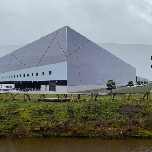 Een foto van een bord wat het nieuwe bouwford gebouw adverteerd
