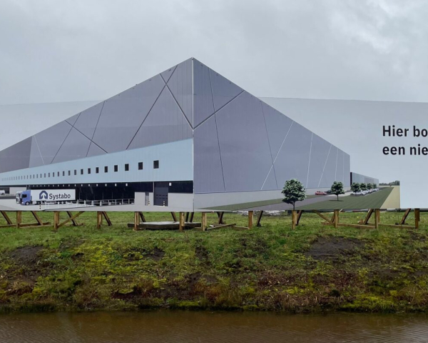 Een foto van een bord wat het nieuwe bouwford gebouw adverteerd